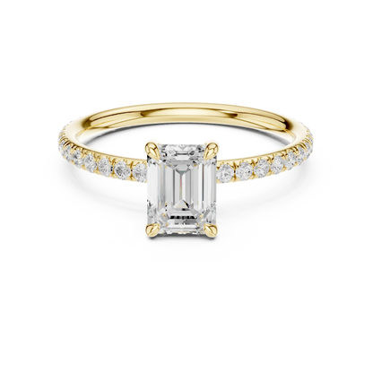 Lab-grown emerald cut solitaire ring in yellow gold with thin pavé diamond band