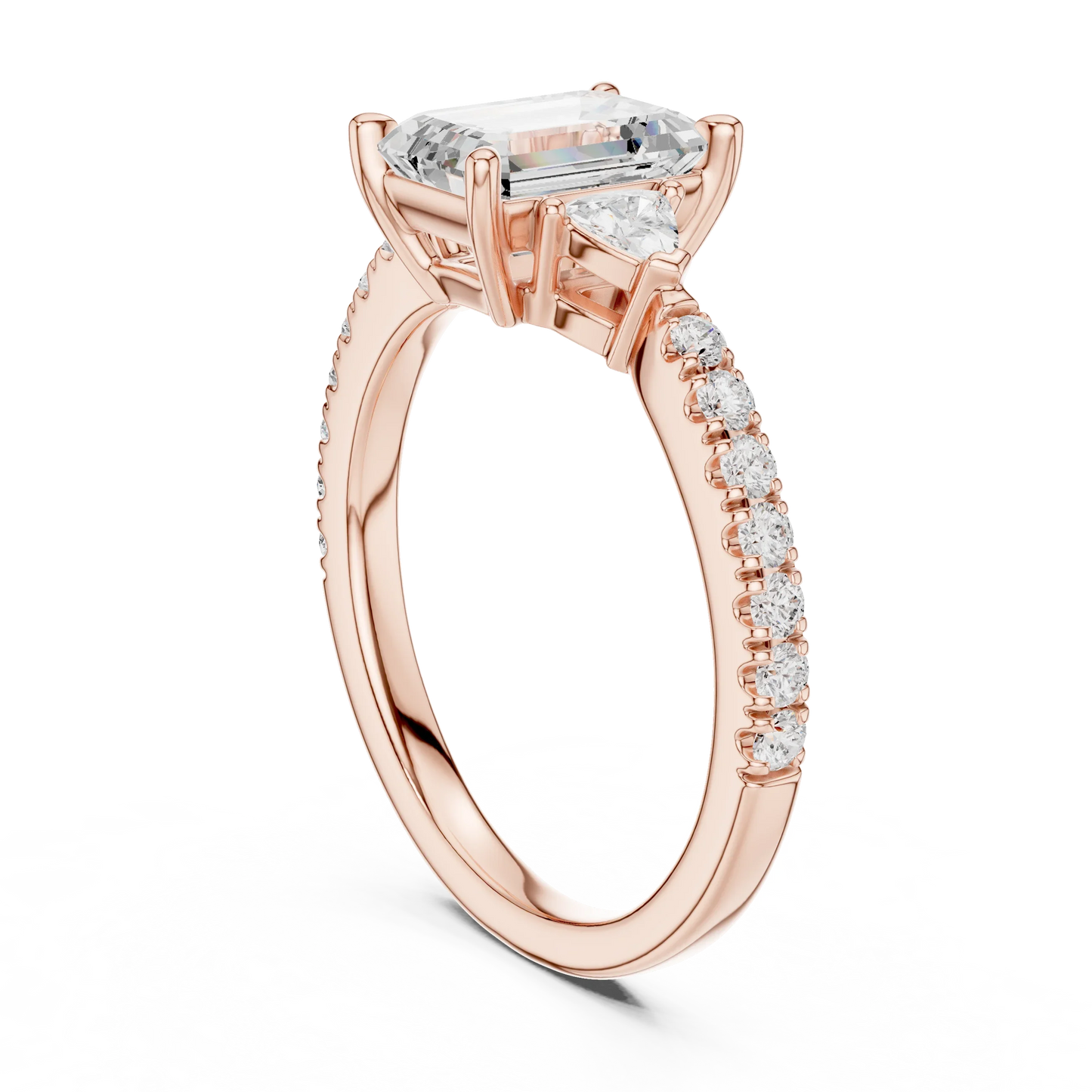Back side view of rose gold emerald three stone diamond pave ring, detailing band and setting.