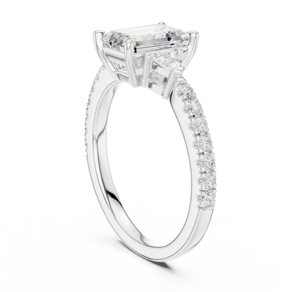 Back side view of white gold emerald three stone diamond pave ring, showing band and setting.