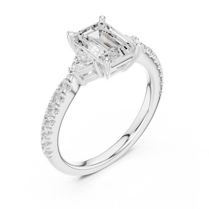 Front view of white gold emerald cut three stone diamond pave ring, showcasing center and side stones.