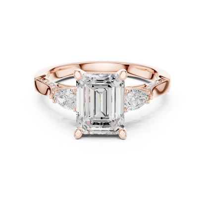 Emerald three stone ring in rose gold with pear side stones, accent band and lab-grown diamonds 鈥?Australia