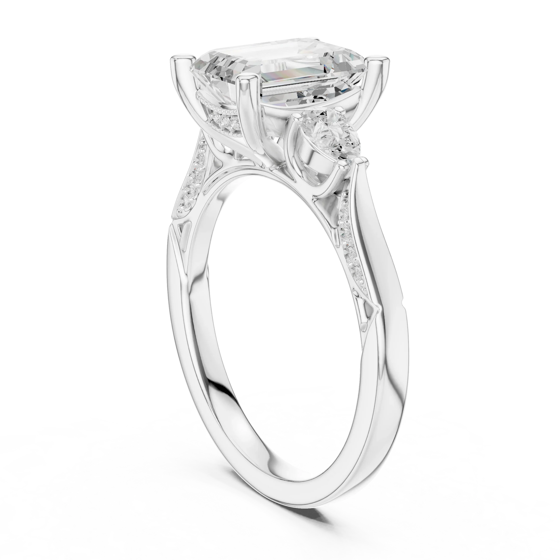 Back side view of white gold emerald three stone ring with pear side stones, accent band and lab-grown diamonds 鈥?Australia