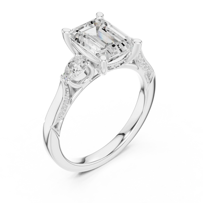 Front view of white gold emerald three stone ring with pear side stones, accent band and lab-grown diamonds 鈥?Australia