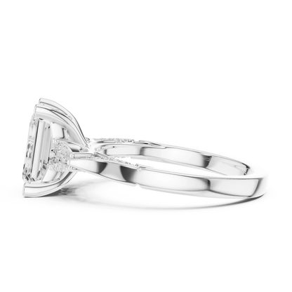 Side view of white gold emerald three stone ring with pear side stones, accent band and lab-grown diamonds 鈥?Australia