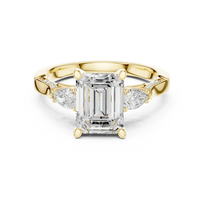 Emerald three stone ring in yellow gold with pear side stones, accent band and lab-grown diamonds 鈥?Australia