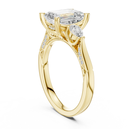 Back side view of yellow gold emerald three stone ring with pear side stones, accent band and lab-grown diamonds 鈥?Australia