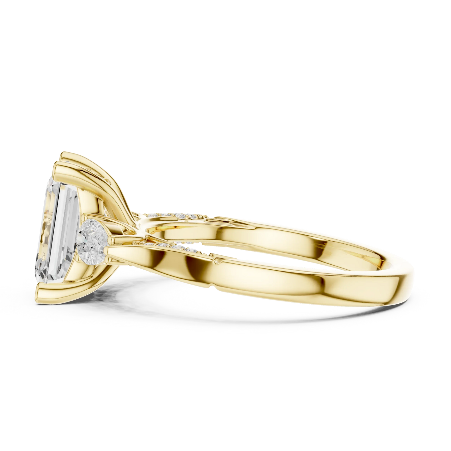 Side view of yellow gold emerald three stone ring with pear side stones, accent band and lab-grown diamonds 鈥?Australia