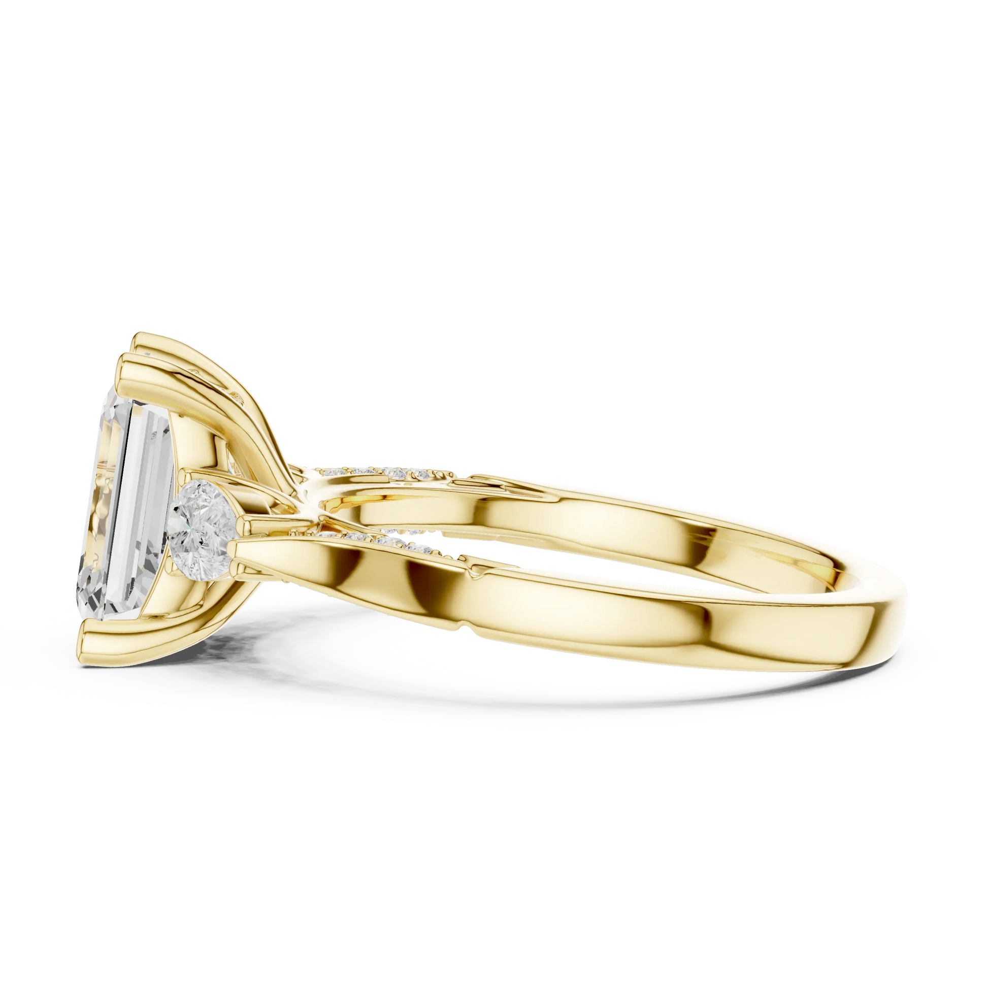 Side view of yellow gold emerald three stone ring with pear side stones, accent band and lab-grown diamonds 鈥?Australia