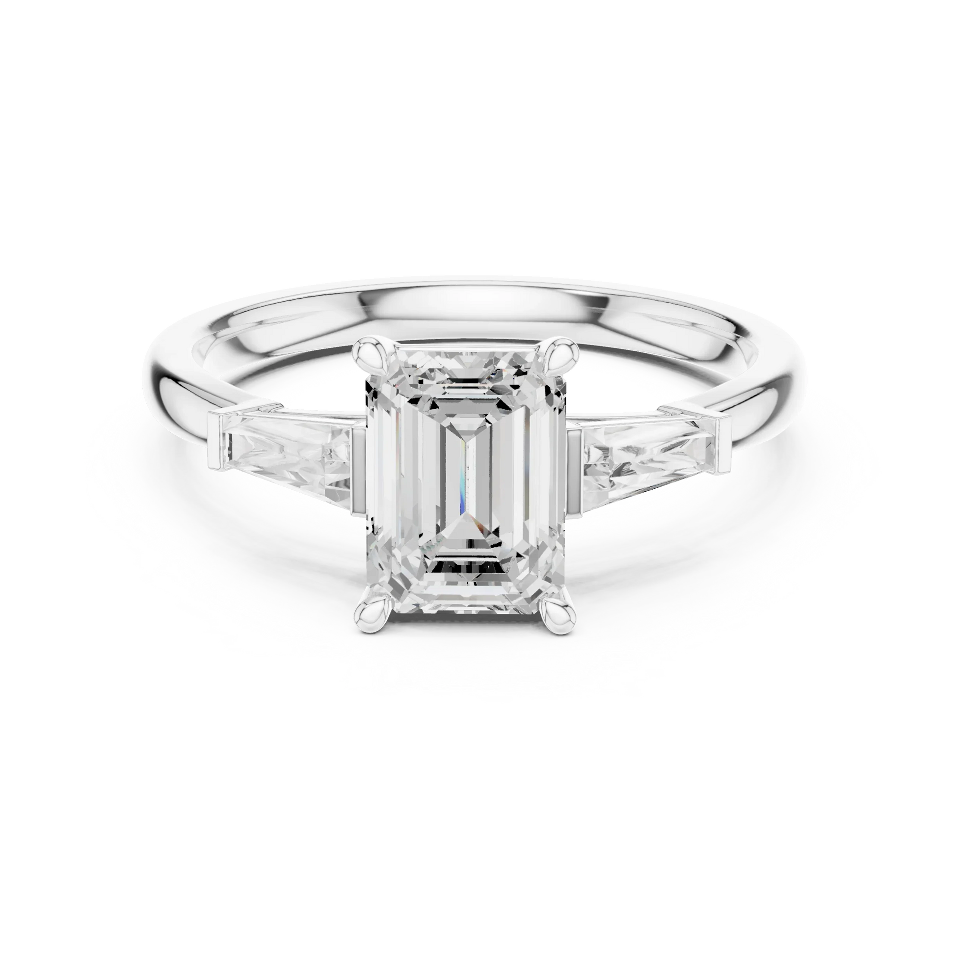 White gold emerald three-stone ring with tapered baguette side stones