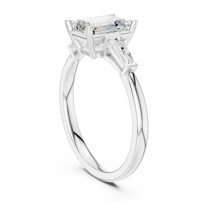 White gold emerald three-stone ring with tapered baguette side stones Top view