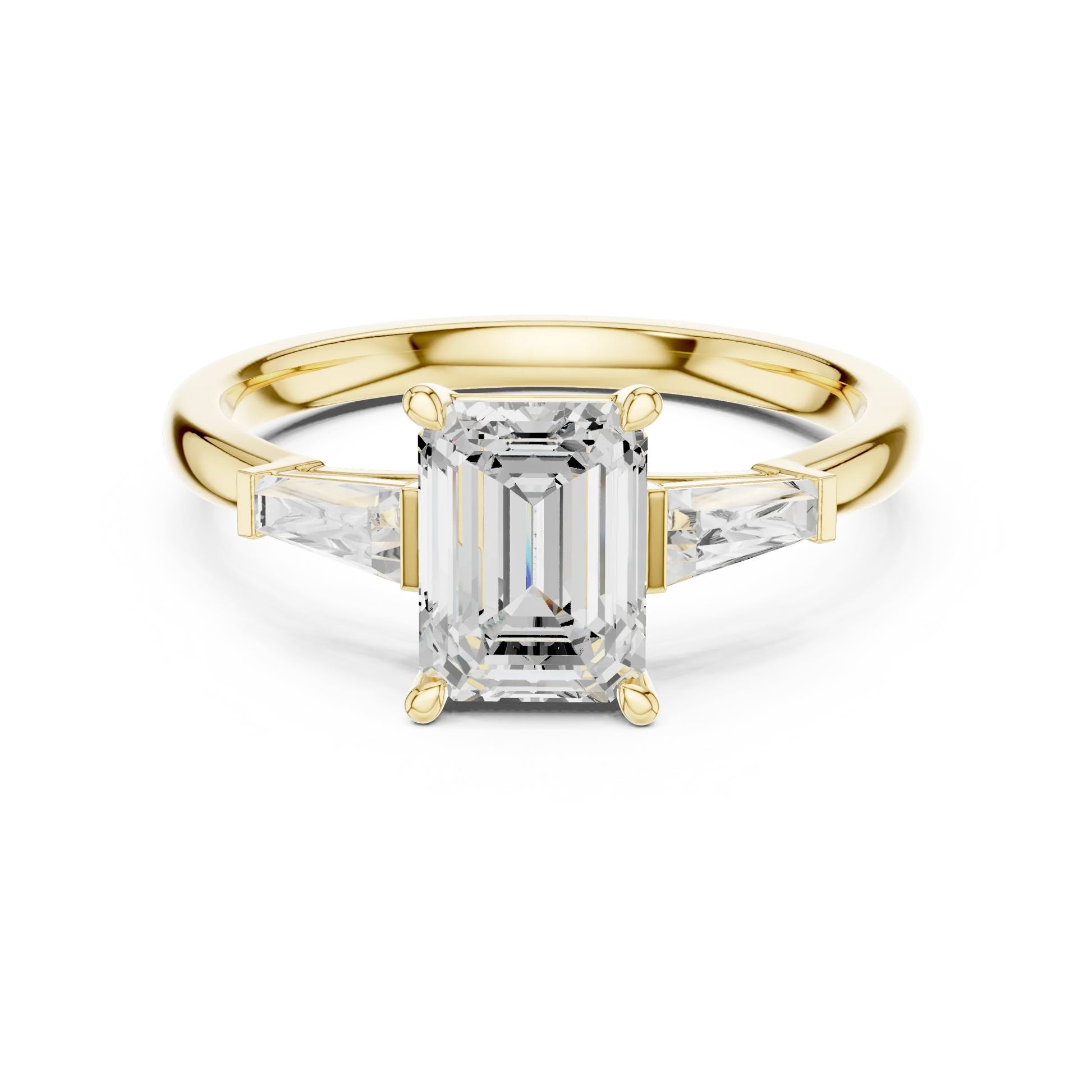 Yellow gold emerald three-stone ring with tapered baguette side stones