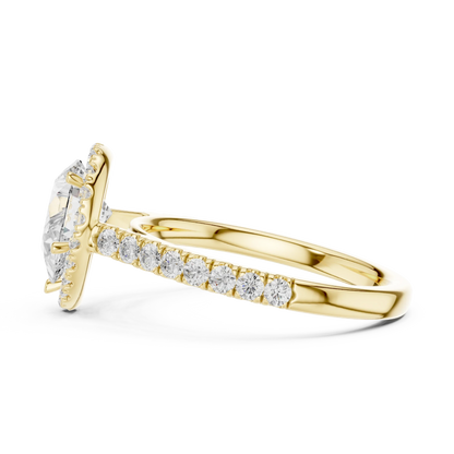 Side view of yellow gold pear cut diamond ring with halo setting highlighting band structure and center stone elevation