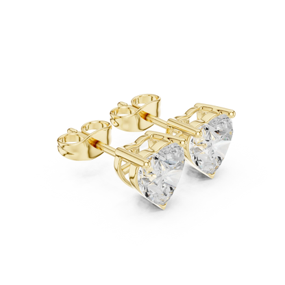 Gold heart-shaped stud earrings with clear gemstones on a white background with side view