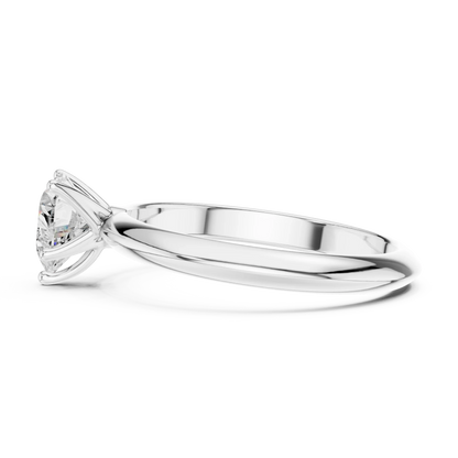 Side view of white gold heart shape diamond solitaire ring, highlighting prong setting.
