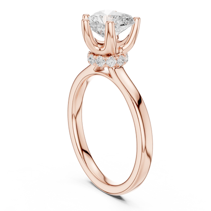 Back view of rose gold heart cut solitaire ring showing hidden halo and domed band structure