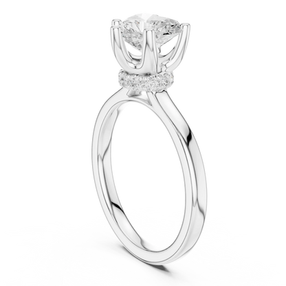 Back view of white gold heart cut solitaire ring showing hidden halo and domed band details