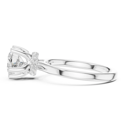 Side view of white gold heart cut solitaire ring highlighting hidden halo and domed band design