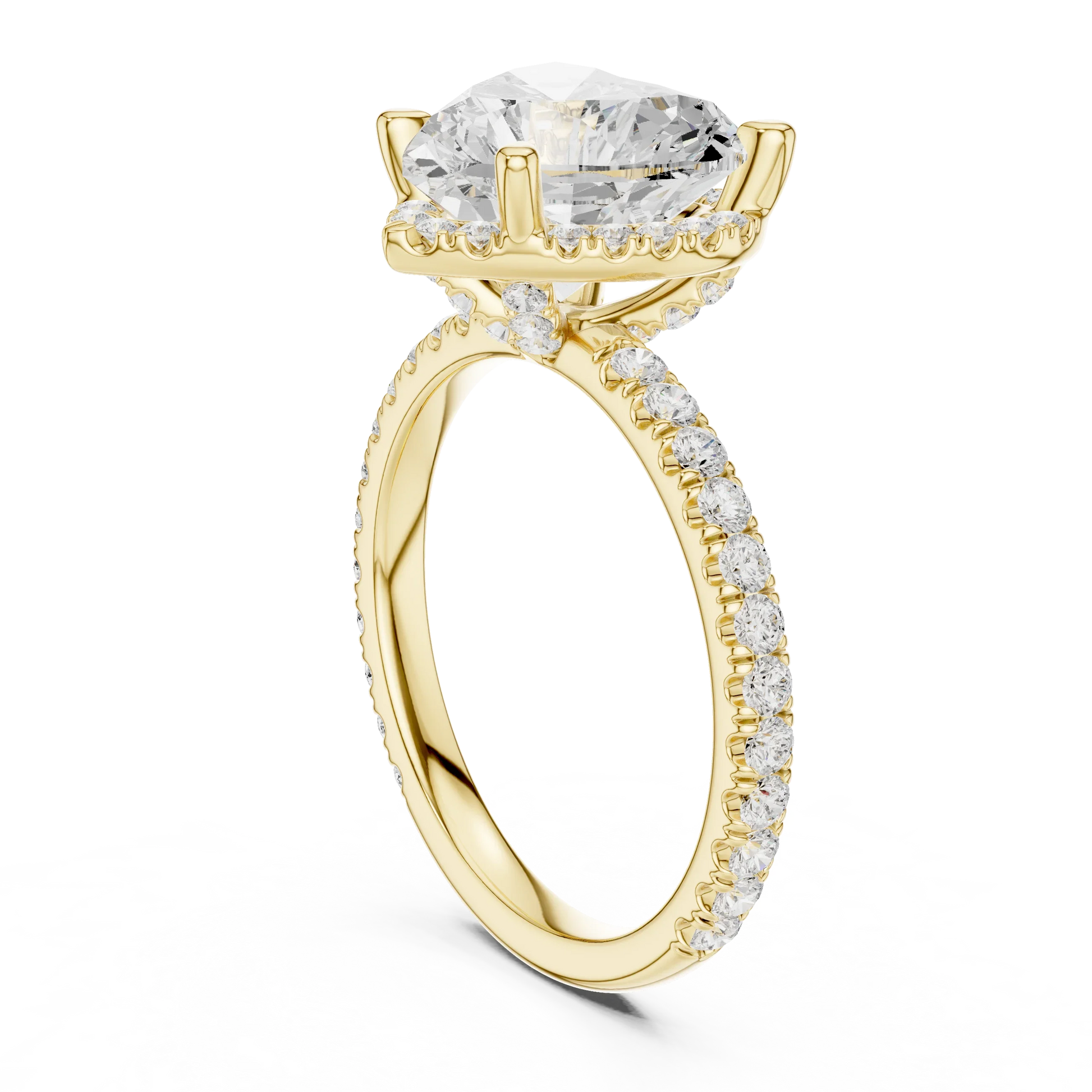 Back side view of yellow gold heart cut solitaire ring showing hidden halo and thin pav茅 band details