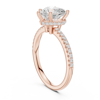 Back side view of rose gold heart cut solitaire ring showing thin pave band and setting structure