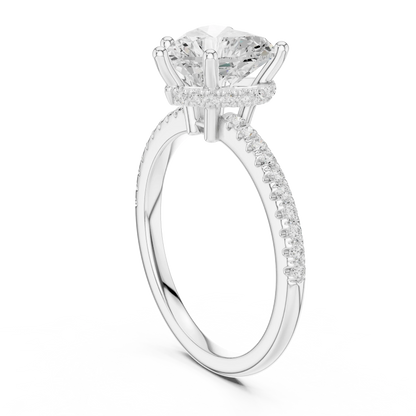 Back side view of white gold heart cut solitaire ring showing thin pave band and setting details