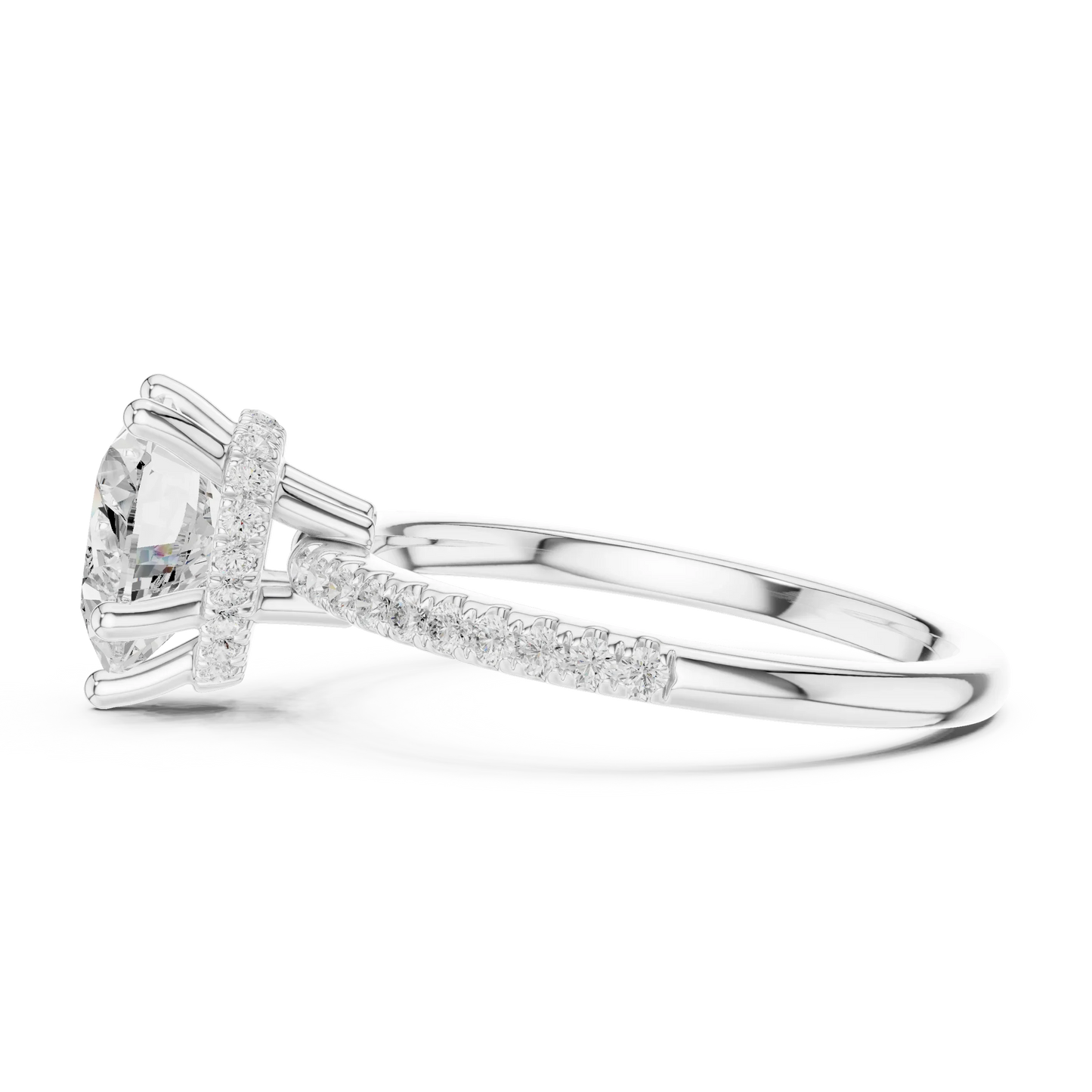 Side view of white gold heart cut solitaire ring highlighting thin pave band and prong setting