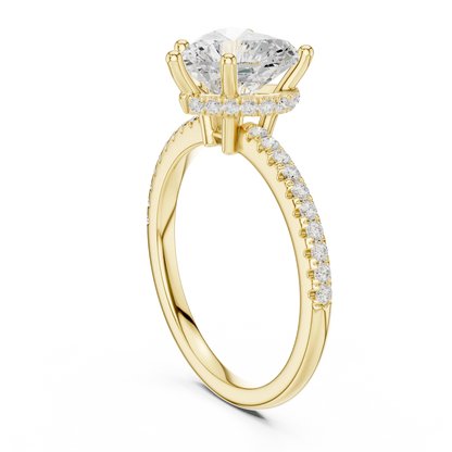Back side view of yellow gold heart cut solitaire ring showing thin pave band and mounting details