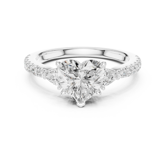 Lab-grown heart shape three stone diamond ring with half moon side stones and pave band in white gold, top view.
