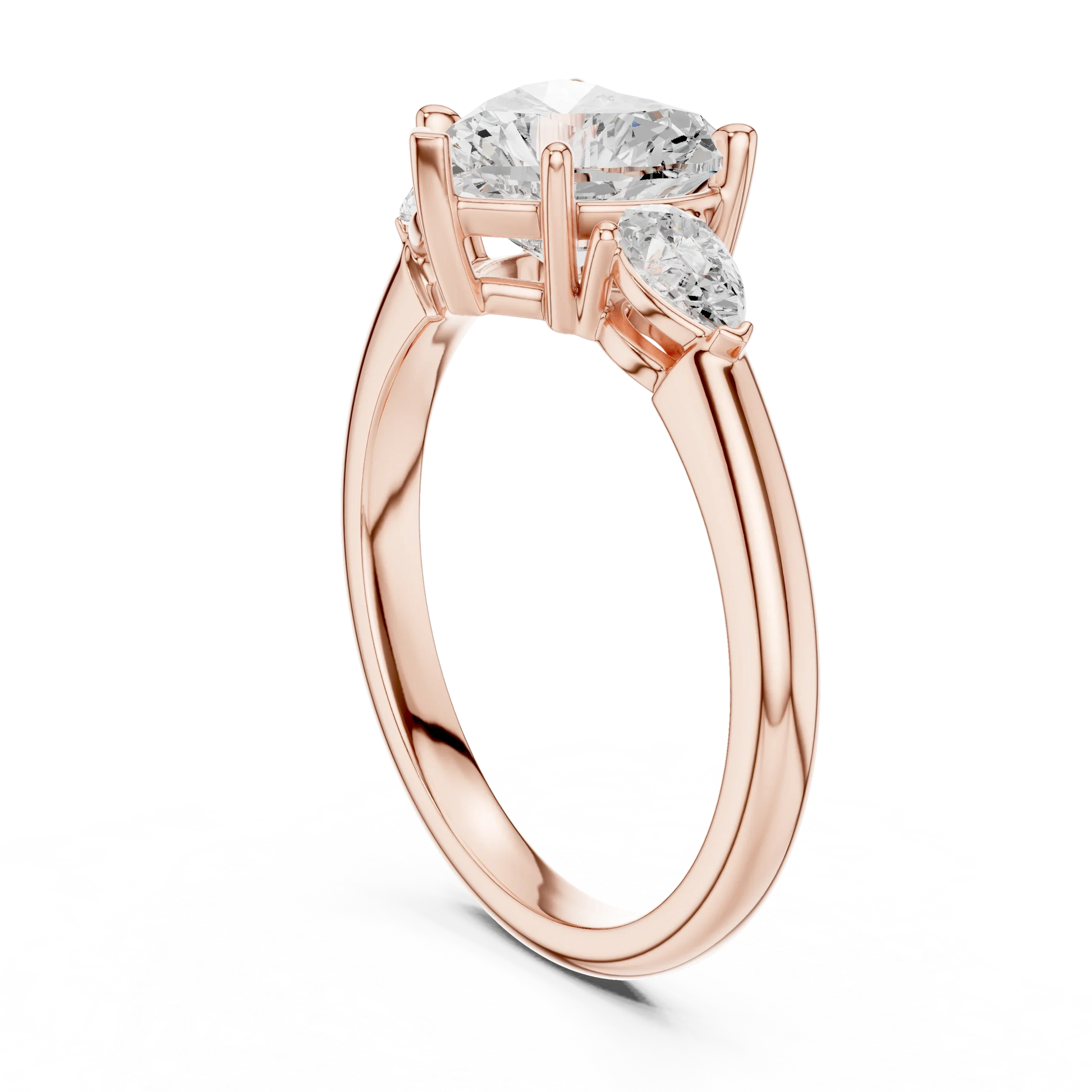 Front view of rose gold heart three-stone ring with pear side stones and lab-grown diamond 鈥?Australia