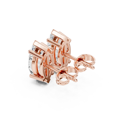 Rose gold earrings on a white background in a back side view