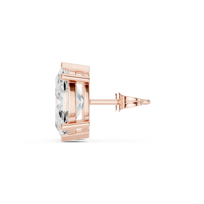 Rose gold earring with clear gemstone on a white background in side view