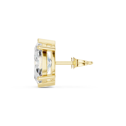 Gold earring with clear gemstone on a white background with side view