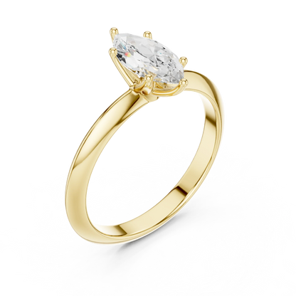 Front view of yellow gold marquise diamond solitaire ring, emphasizing brilliance