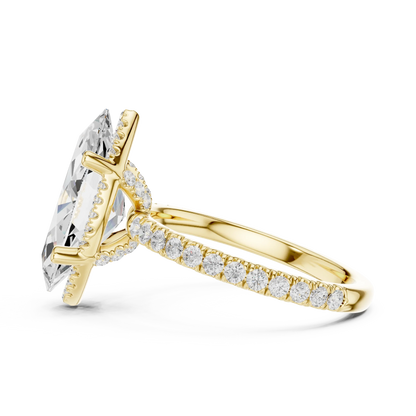 Side view of yellow gold marquise cut solitaire ring highlighting hidden halo and thin pav茅 band design