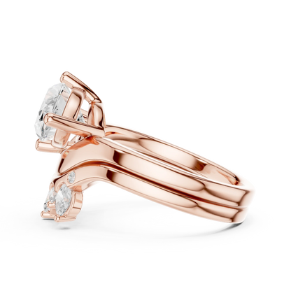 Side view of rose gold marquise solitaire ring with crown tiara band highlighting setting and profile