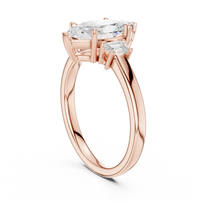Back side view of rose gold marquise three stone diamond ring, detailing band and setting.