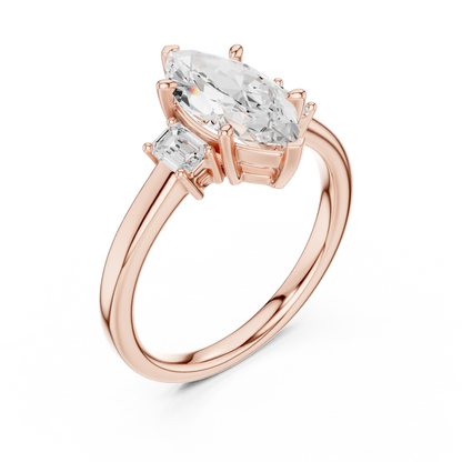 Front view of rose gold marquise three stone diamond ring, showcasing gemstone brilliance