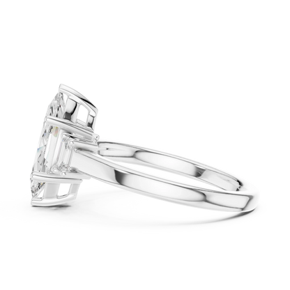 Side view of white gold marquise cut three stone diamond ring, highlighting setting profile