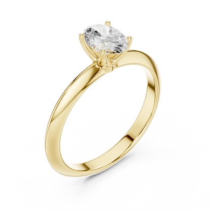 Front view of yellow gold oval diamond solitaire ring, emphasizing brilliance.