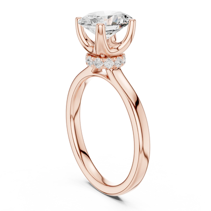 Back view of rose gold oval cut solitaire ring showcasing hidden halo and domed band design
