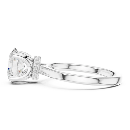 Side view of white gold oval cut solitaire ring highlighting hidden halo and domed band design