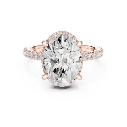 Rose gold oval cut solitaire ring with hidden halo and thin pav茅 band featuring lab-grown diamond, modern delicate look