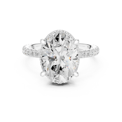 White gold oval cut solitaire ring with hidden halo and thin pav茅 band featuring lab-grown diamond, elegant design