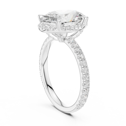Back side view of white gold oval cut solitaire ring showing hidden halo and thin pav茅 band details