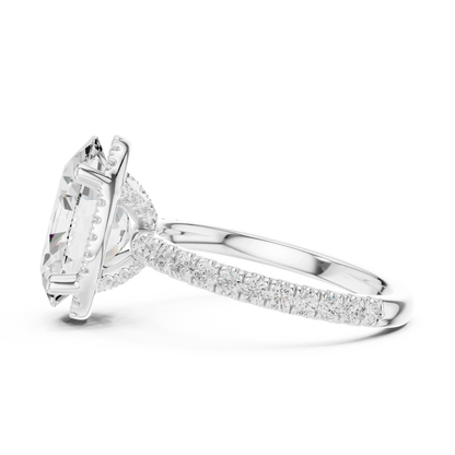 Side view of white gold oval cut solitaire ring highlighting hidden halo and thin pav茅 band design