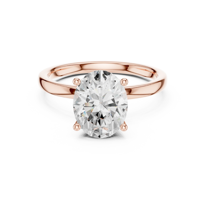 Lab-grown oval cut solitaire ring in rose gold with plain domed band