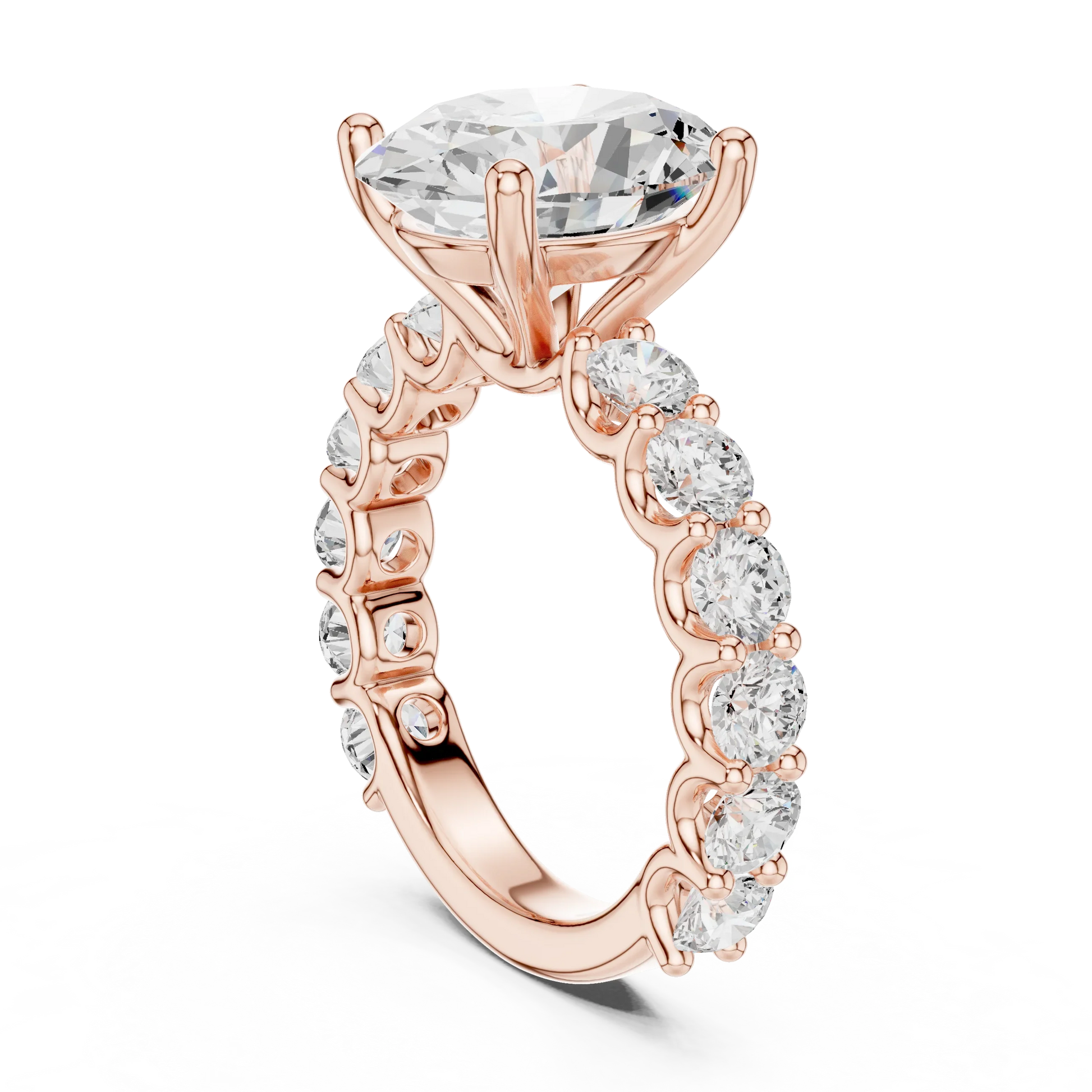 Back side view of rose gold oval cut solitaire ring showing shared prong large stone band and setting details
