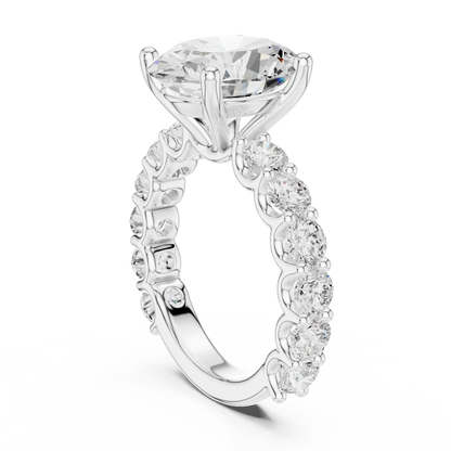 Back side view of white gold oval cut solitaire ring showing shared prong large stone band and setting details