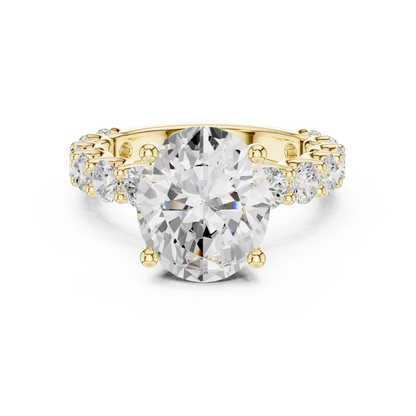Lab-grown oval cut solitaire ring in yellow gold with shared prong large stone band