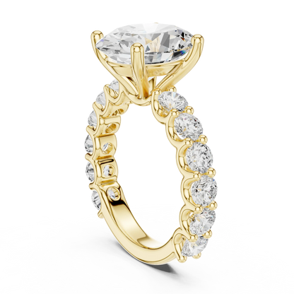Back side view of yellow gold oval cut solitaire ring showing shared prong large stone band and setting structure