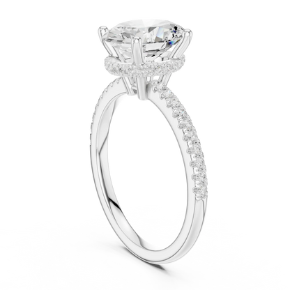 Back side view of white gold oval cut solitaire ring showing thin pave band and setting details